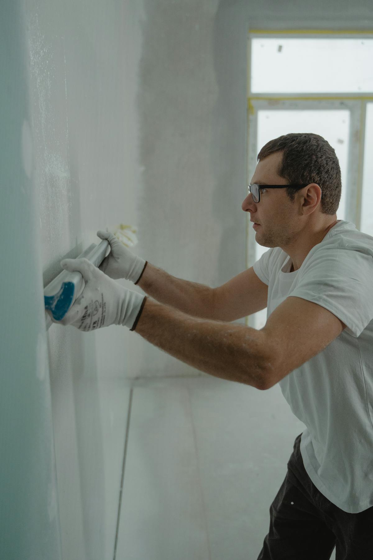 Drywall Patch — Patching a hole or crack in drywall, ready for paint.